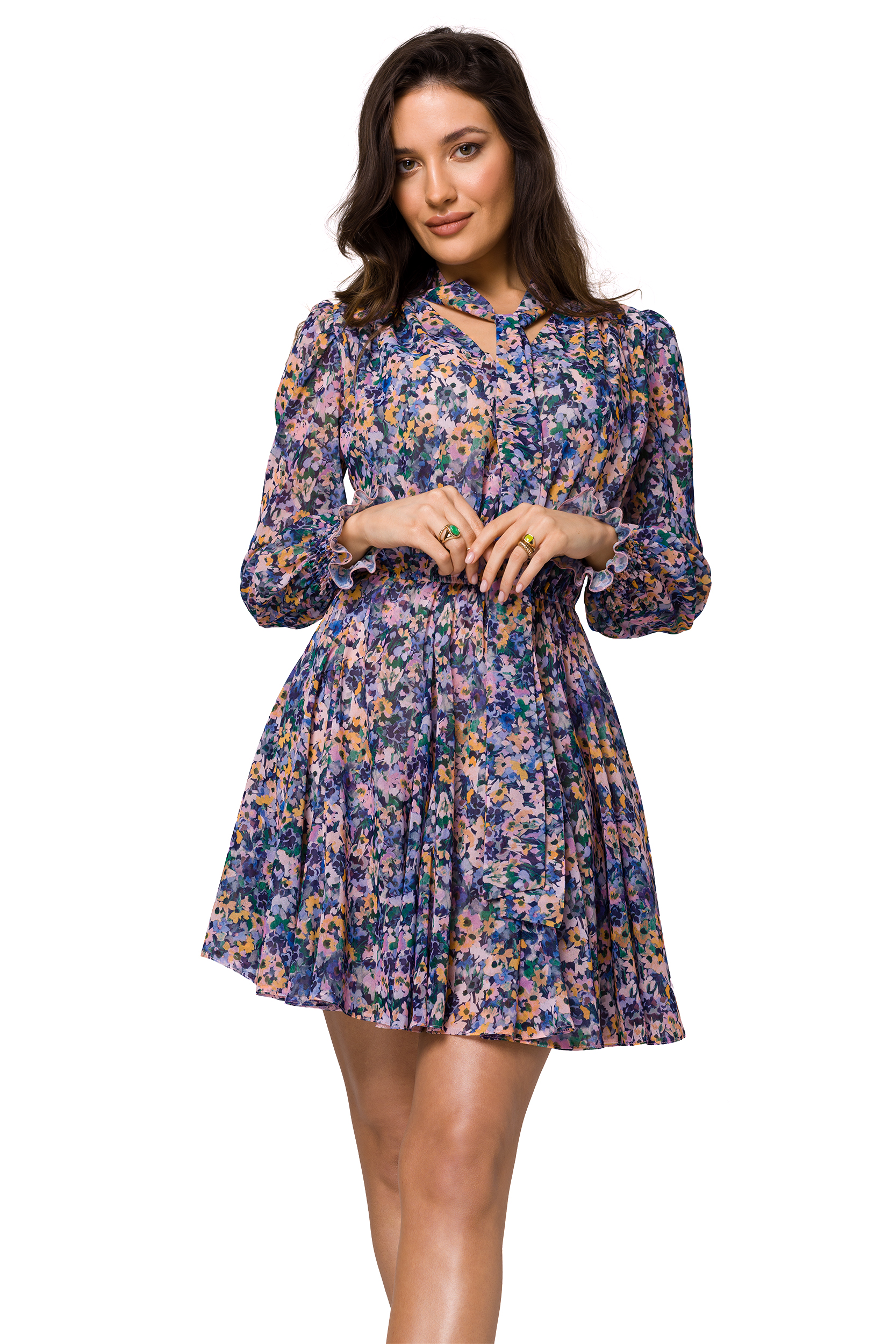 Woman modeling floral dress on white background