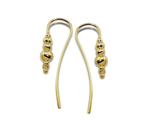 Gold beaded dangle earrings on white background.