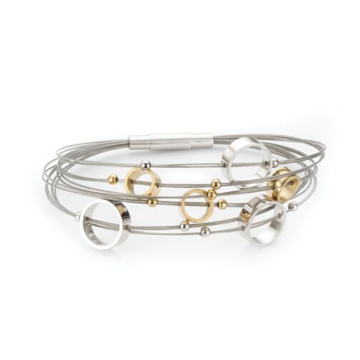 Silver and gold bangle bracelets on white.