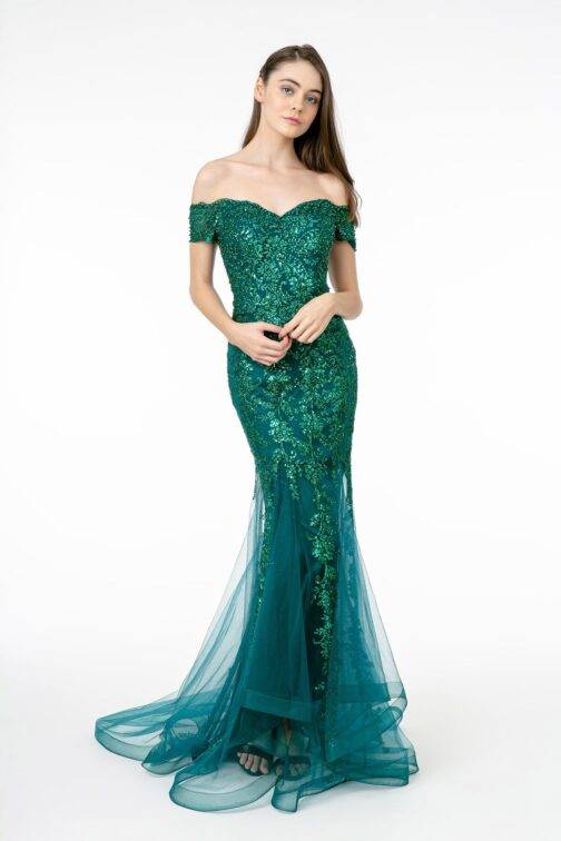 Woman in elegant green sequined evening gown