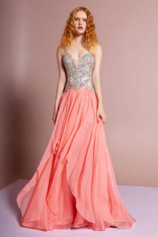 Woman in elegant coral evening gown.