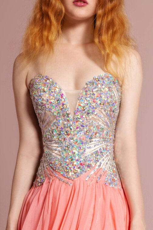 Woman in sparkling sequin bodice and peach dress.