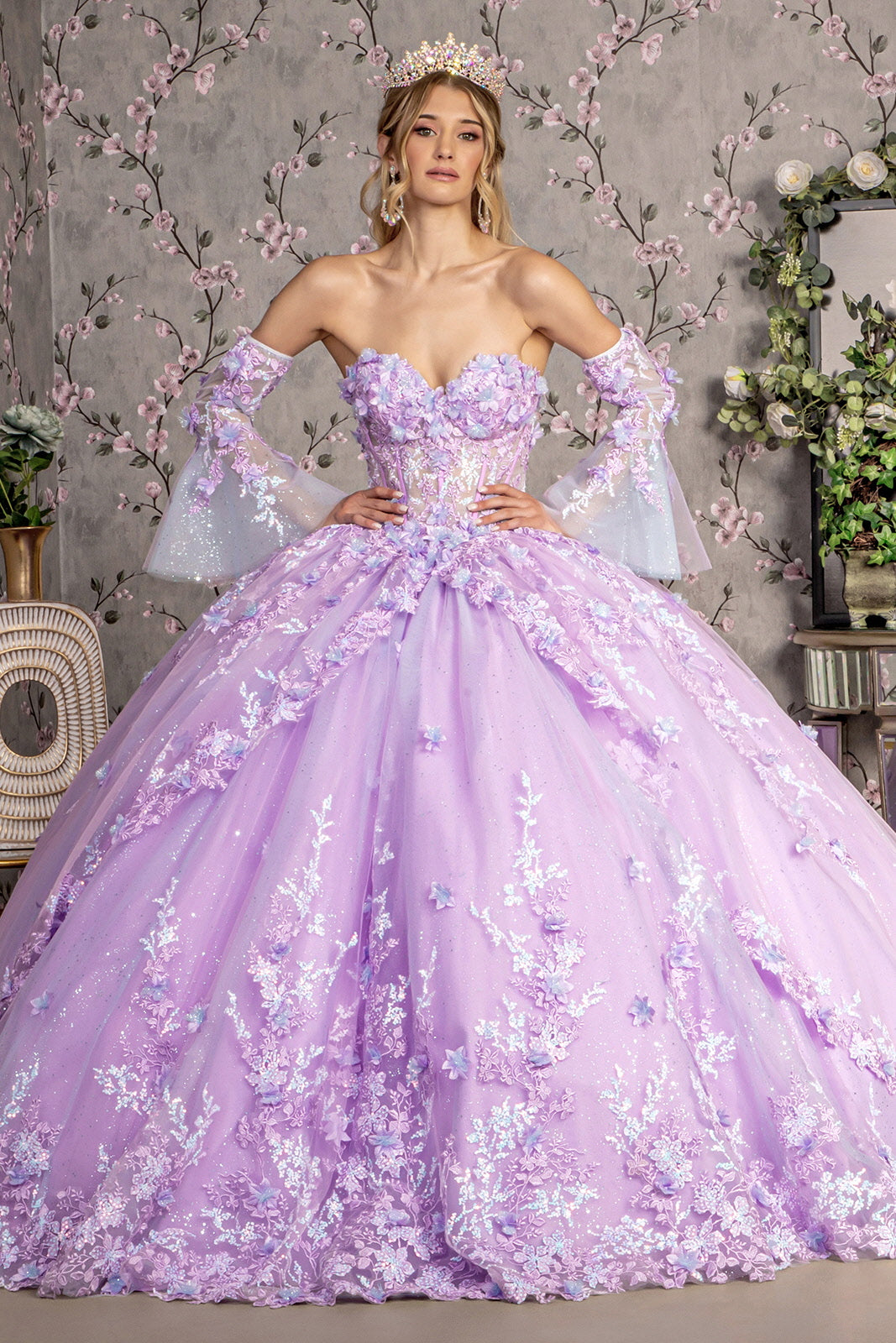 Woman in elaborate purple floral ball gown.